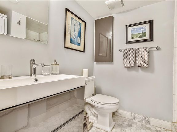 Full bath with shower and washer/dryer
