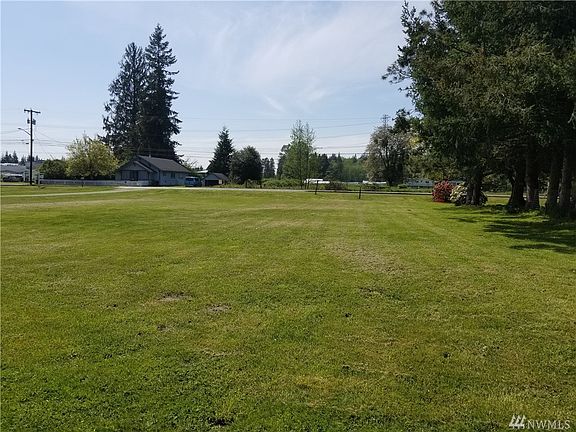 Standing partway into the acreage looking back at Fruitdale Rd. with the driveway visible to the left.  The home is on the other side of Fruitdale Road 