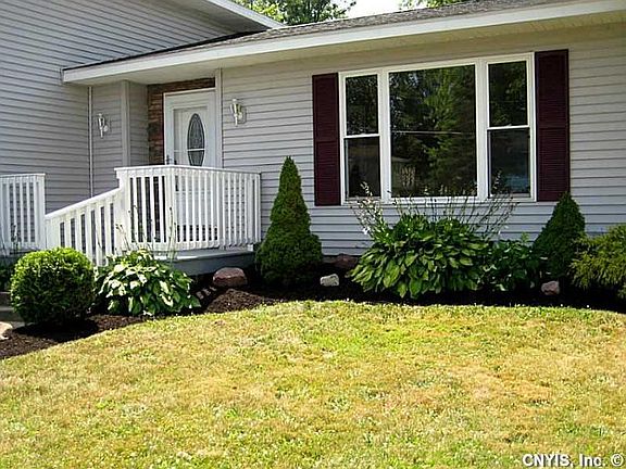 Exterior Front. Beautiful landscaping!