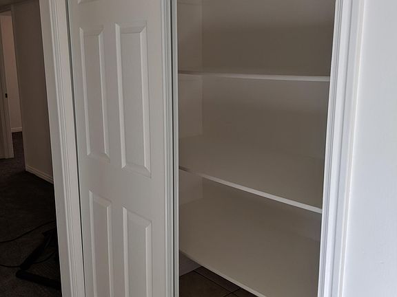 Large pantry with huge shelves.