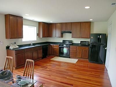 Kitchen Tall Cabnits Wood Floors