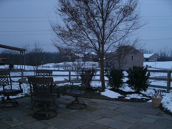 Backyard features include fencing, patio & gas line for grilling!