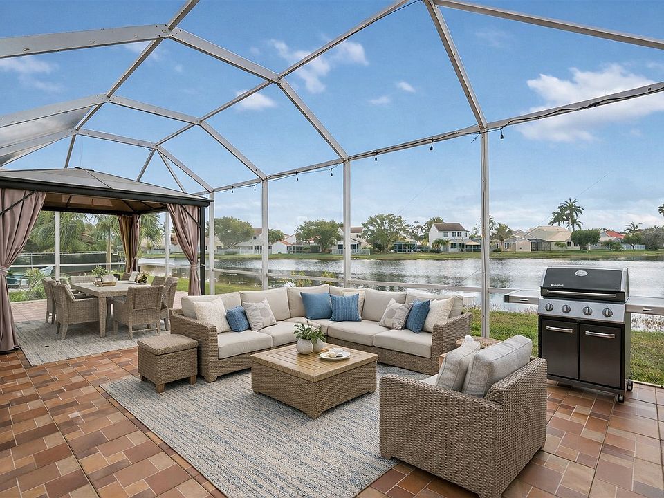 Screened Patio Lake Front-Virtually staged to showcase the home's full potential and help you envision your lifestyle in each space.