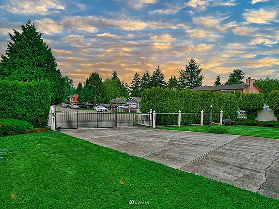 Long driveway has room for several vehicles!