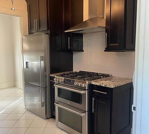 Kitchen with marble countertops and high-grade appliances.