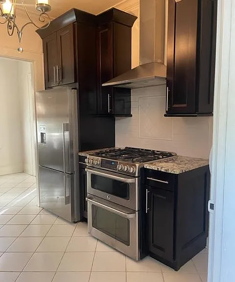 Kitchen with marble countertops and high-grade appliances.