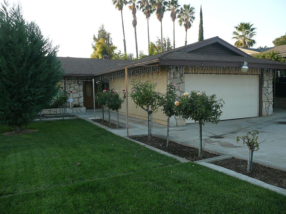 Front Entry lined with Rose bushes