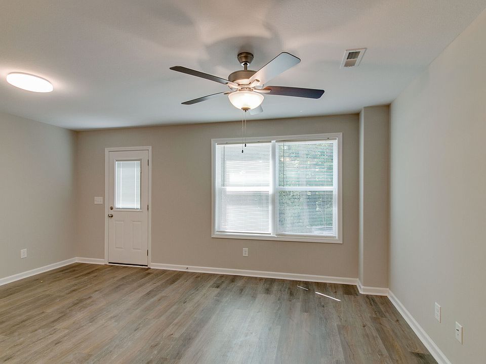 Great room open to kitchen. LVP Flooring on Main level Back door leads to outside patio