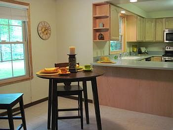 Informal dining area off of the kitchen and a breakfast bar for those hetic mornings. 