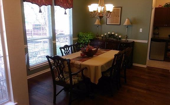 Formal dining room. As the house is entered through the front door, immediately to the left will be the formal dining room with hard wood flooring. Chair rail & crown molding.