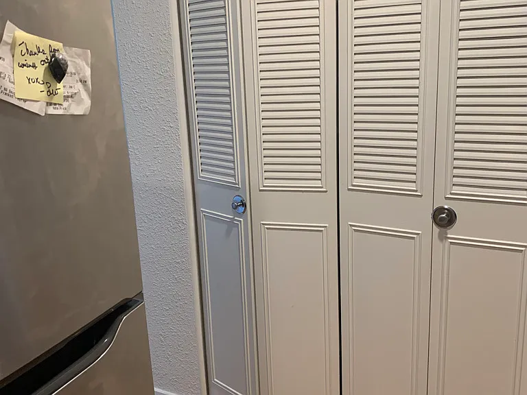 large pantry behind kitchen bifold doors