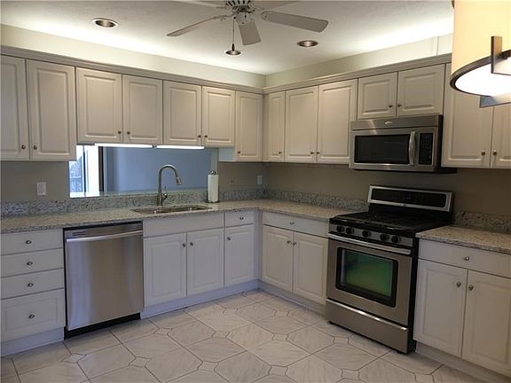 This well designed kitchen has plenty of counter top space and cabinetry.