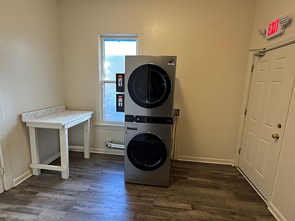 Entry foyer featuring washer and dryer.