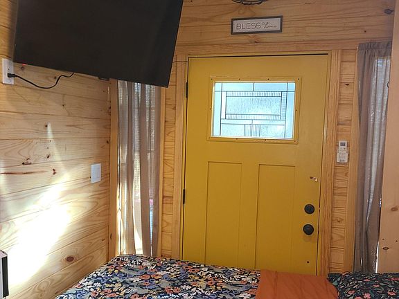Murphy bed operated with remote control /50 inch smart tv
transom windows/leaded glass door