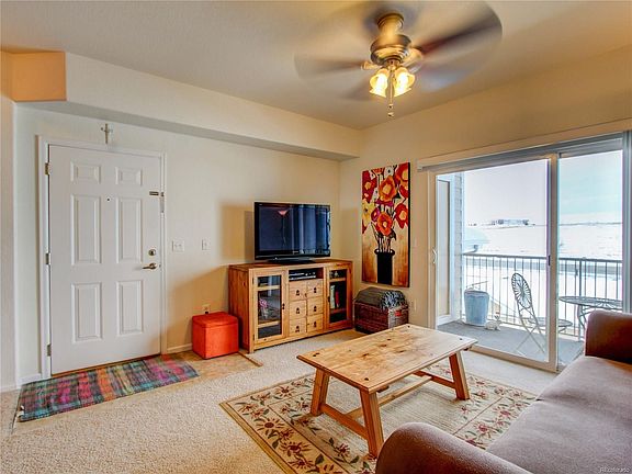 LARGE LIVING ROOM WITH ACCESS TO WEST FACING COVERED DECK