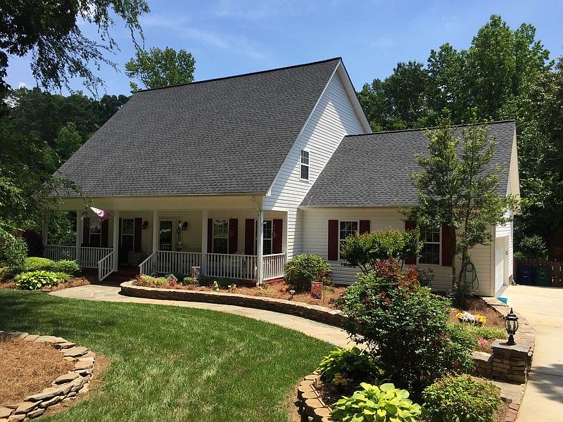 Front Of Home : Wow - Look at the roof , Great Yard , Stone Walk Way