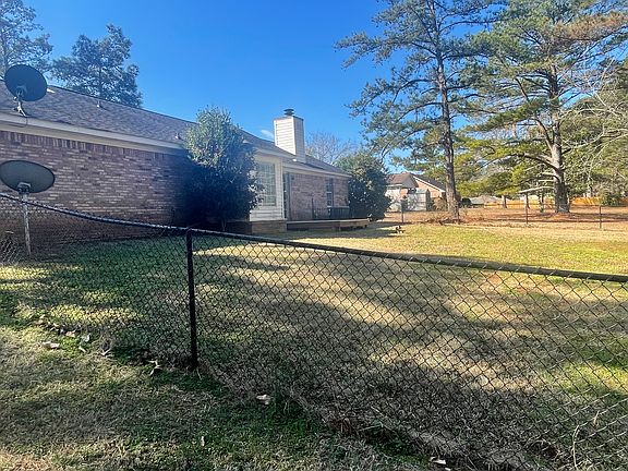 Fenced in backyard with deck off of living room