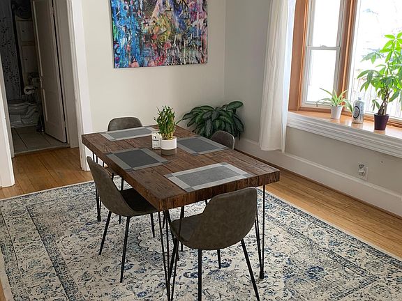 Dining room with large bay-window and open-concept.