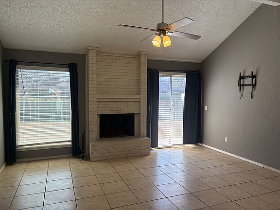 Living room with wood burning fireplace