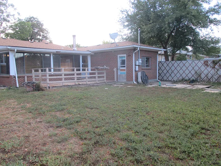 Huge fenced back yard with large deck.