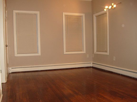 Refinished hardwoods, new plaster and paint