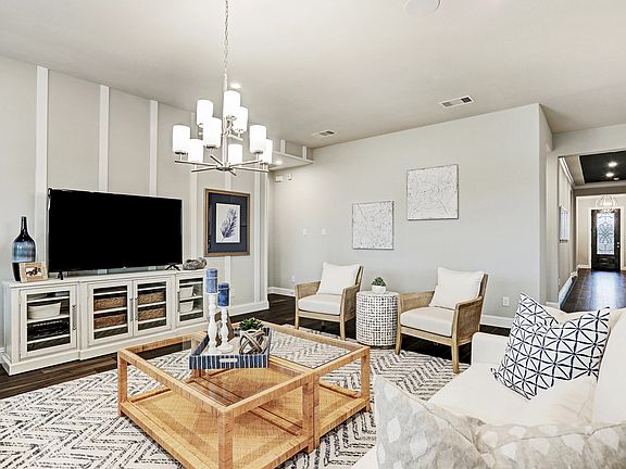 Plan 5029 Living Room Modeled at Del Bello Lakes