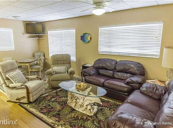 Comfy couches and chairs line our spacious living room!