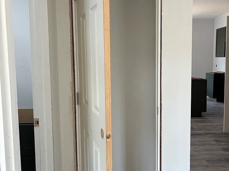 Linen/storage closet by bathrooms
