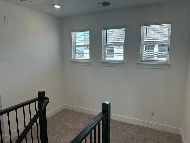 Flex area at the top of the stairs for a desk or bookshelf