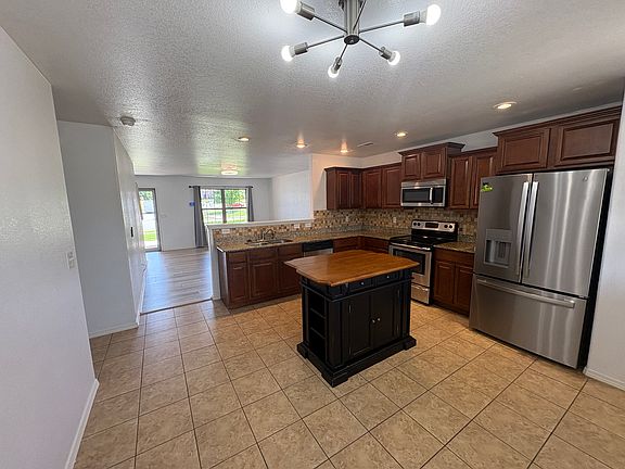 Kitchen opens to bright and open primary living area