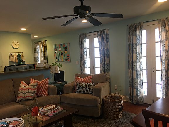 French doors line one wall of the kitchen/living rm adding t