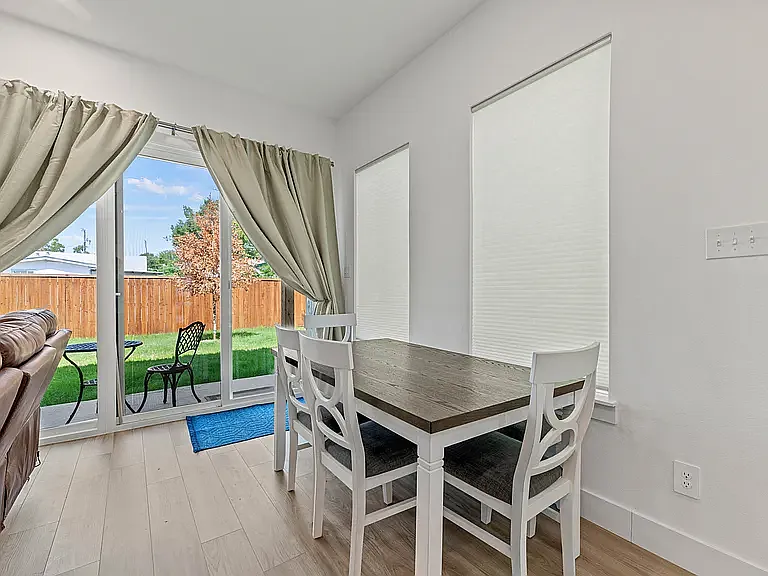 This dining table includes a bench for additional seating, just pull the table away from the wall.
Sliding glass door offers nine feet of windows to view the backyard.