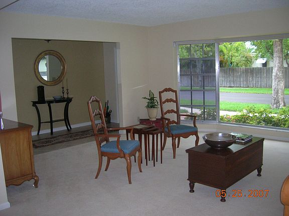 Living room opens to dining area.