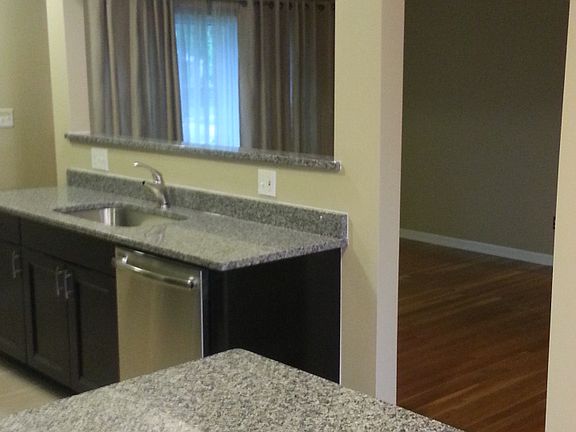 Kitchen looking into living room, open floor plan.