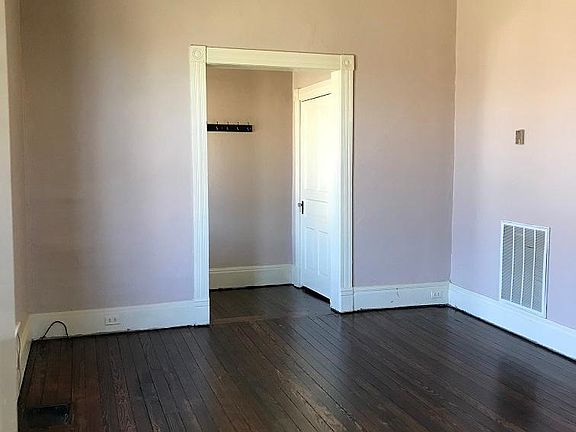 LIving room high ceilings, hardwood floors, large windows