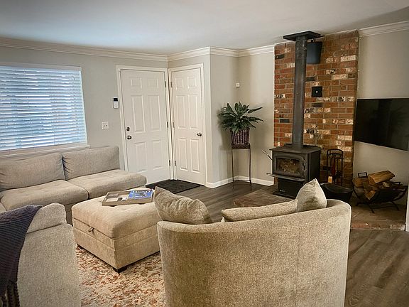 Large living room with coat closet at entry