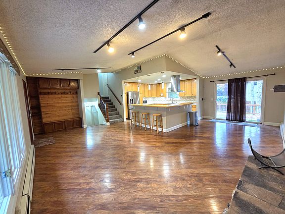 Living room/Remodeled entry way with cedar wall and bench.