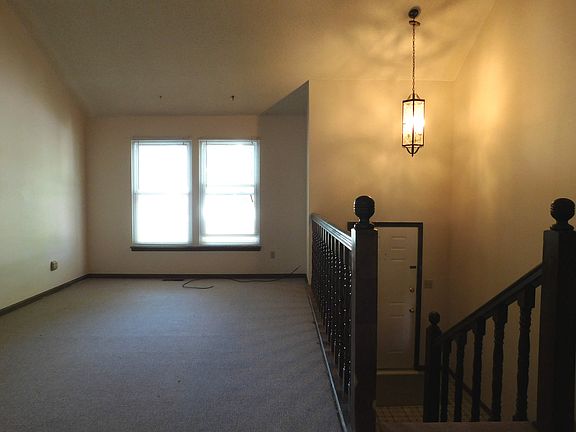 Living room w/ vaulted ceiling