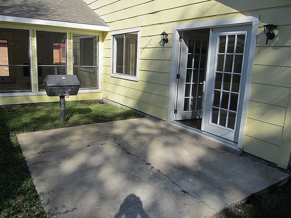 Backyard area with built in grill perfect for summer.