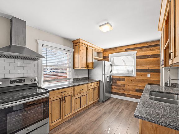 Kitchen with wood accent wall