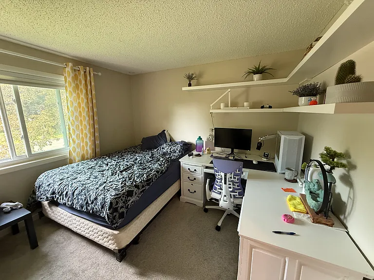 Left Upstairs bedroom (current tenant setup with large desk & full bed)