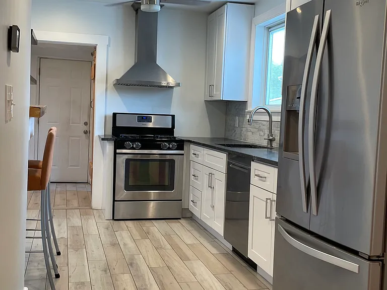 Updated kitchen with stainless steel appliances, recessed lighting, and a bright, functional layout.