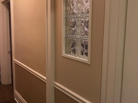 Glass block window in hall brings in more light.