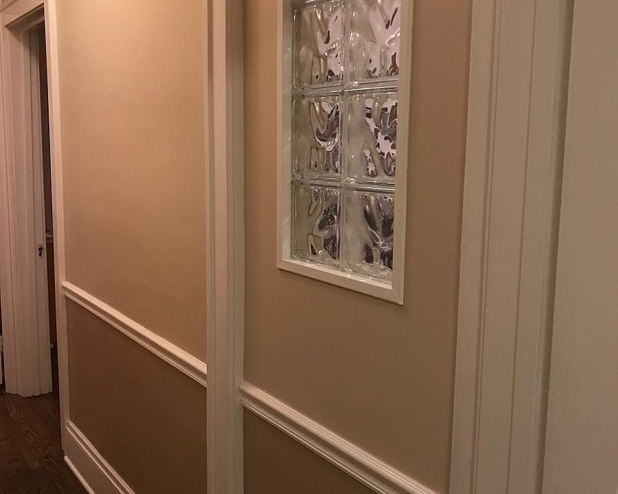 Glass block window in hall brings in more light.