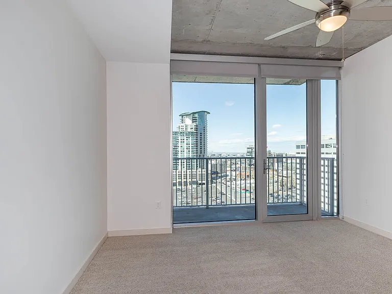 Carpeted Bedroom with Balcony