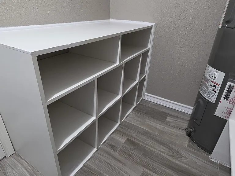 Cabinet organizer: holder for baskets for clean clothes for each person.