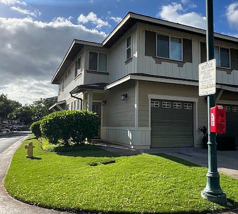 Front view with 1 car garage and driveway