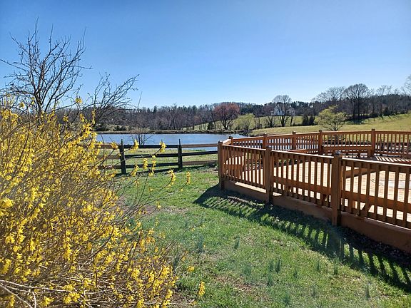 yard, deck, and lake view