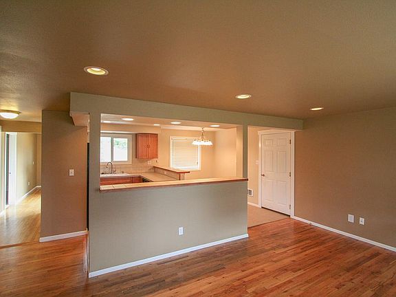 Living Room and Open Kitchen floorplan, hallway to Bathroom #1, 2nd Bedroom and Master Bedroom.