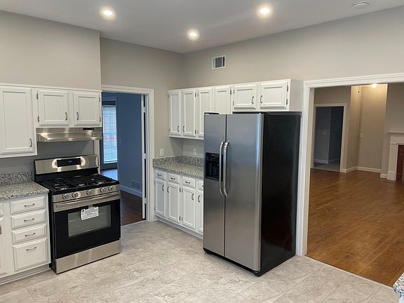 Kitchen (Picture 1) - All new appliances, counters, fixtures, lighting, and flooring!